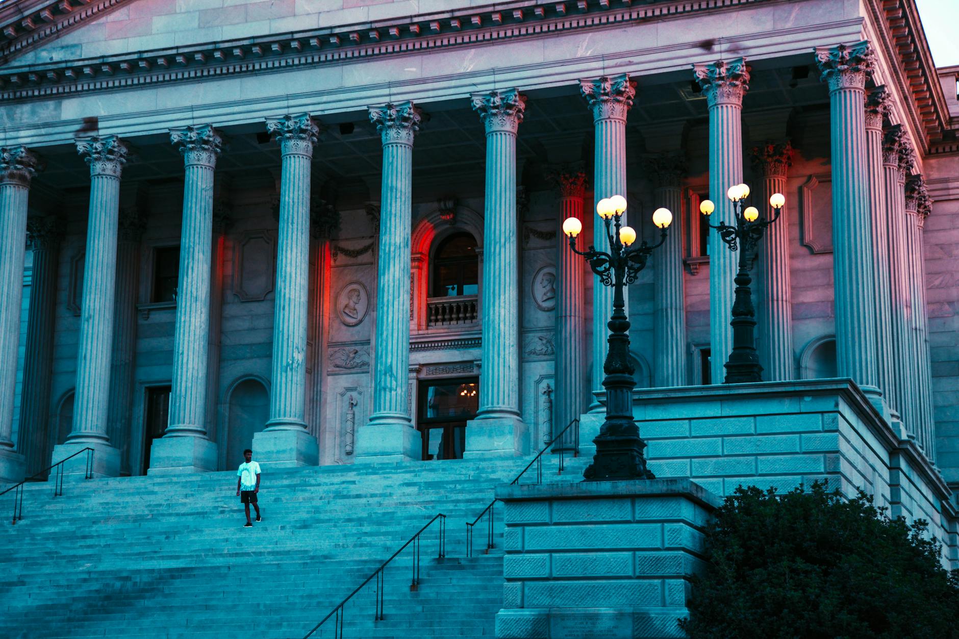 Captivating evening view of the South Carolina State House with grand columns and soft lighting.